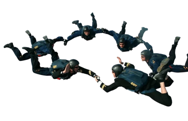 Managed It Services - Image showing a group of people skydiving together holding each others hands.